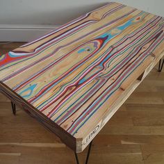 a wooden table with multicolored lines on it