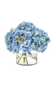 a vase filled with blue flowers on top of a table