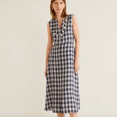 100 % Linen Fabric. Flared Design. Gingham Check Fabric. Sleeveless. V-Neck. Zip Fastening On The Back Section. Decorative Buttons. Elegant V-neck Dresses For Picnic, Elegant V-neck Dresses For Picnics, Elegant Sleeveless Midi Dress For Picnic, Sleeveless Plaid Midi Dress For Summer, Sleeveless Gingham Midi Dress For Daywear, Gingham Sleeveless Midi Dress For Day Out, Plaid Sleeveless Dress For Picnic, Sleeveless Plaid Dress For Picnic, Gingham V-neck Dress For Vacation