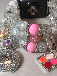 Clear with a splash of pink Apple Watch band ( design available for other smart watches ) charms may vary based on your sentimental values and available charms,. Please include your wrist size. Trendy Pink Beaded Bracelets With Charms, Adjustable Pink Bracelet With Removable Charms, Trendy Pink Jewelry With Bracelet Strap, Trendy Pink Charm Bracelets, Adjustable Pink Jewelry With Removable Charms, Trendy Pink Bracelets With Charms, Pink Bracelet With Removable Charms, Apple Watch Bracelet Band, Pink Apple Watch