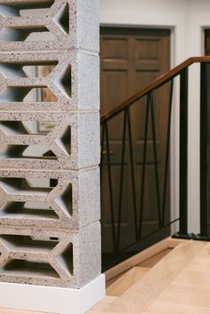 a close up of a wall near a stair case