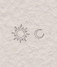 the sun and moon are drawn on paper