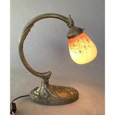 an old fashioned lamp with a light bulb turned on