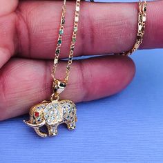 14k Gold Plated Elephant Pendant With Cubic Zirconia And 14k Plated Stainless Steel Necklace.. Different Chain Styles Are Available As Well. 1st- Make Your Purchase 2nd- Dm Me With Your Necklace Selection 3rd - Choose The Length Of Your Necklace Interested Dm Me. Bundle And Receive A Discount On Your Order Shipping Only $3 Ships In 1 Business Day Free Gift Box Is Included Perfect Gifts For Any Occasion. Elephant Pendant, Steel Necklace, Stainless Steel Necklace, Chain Styles, Free Gift, Free Gifts, Business Day, Cubic Zirconia, Gold Plate