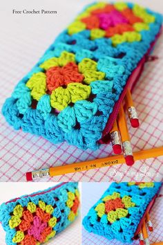 a crocheted pencil case sitting on top of a table next to two orange and yellow pencils