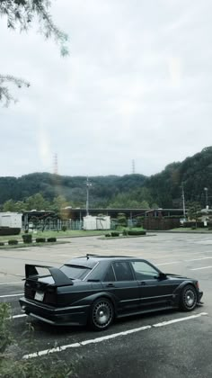 a black car parked in a parking lot