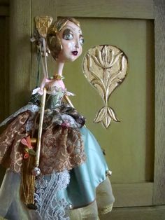 a close up of a doll near a door