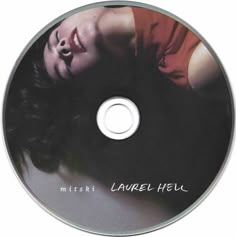 a cd with a woman's face and words on the disc, which reads laurel hell