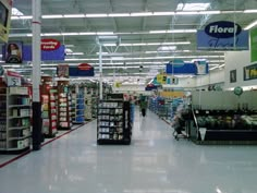 an aisle in a grocery store filled with items