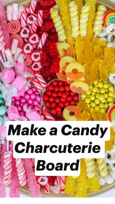 an assortment of candy and candies arranged on a platter with rainbow lollipops