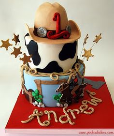 a birthday cake with a cowboy hat on top