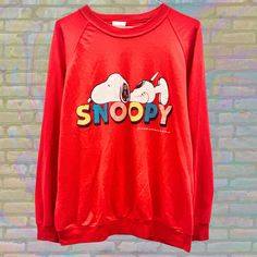 Label size: Large Recommended size: Medium How it fits: Regular Pit to pit: 21" Shoulder to bottom: 25.5" Flaws: Photos show marks if any Material: 50% Cotton/50% Polyester Era: 80s Colour: Red/Multicolor Snoopy Sweatshirt, Snoopy Vintage, Cozy Cartoon, Colour Red, Sweat Shirt, Favorite Outfit, Gender Neutral, Casual Wear, Art Collection