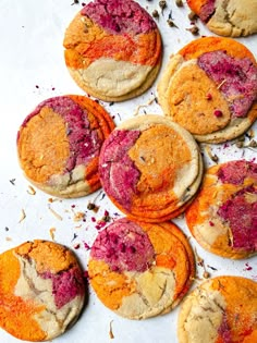 colorful cookies are arranged on a baking sheet