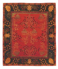 a red and black rug with an intricate design on the center, surrounded by flowers