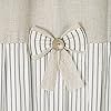 a white curtain with a bow on it