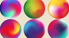 four different colored balls are shown in this image