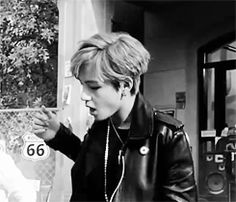 black and white photograph of two people eating food