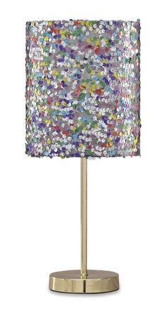 a table lamp with a multicolored shade on the base and a gold metal base