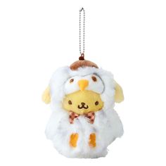 a stuffed animal hanging from a chain on a white background in the shape of a sheep