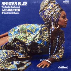 an african blue album cover with a woman laying on the ground wearing a head scarf