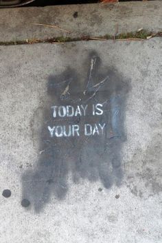 graffiti on the sidewalk that says today is your day