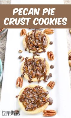 pecan pie crust cookies on a white plate with pecans and chocolate drizzle