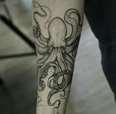 an octopus tattoo on the arm