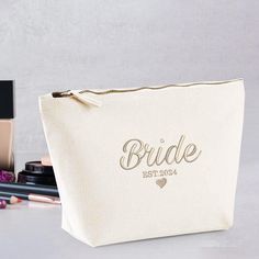 Personalised Bride Makeup Bag, Custom Bride Embroidered Cosmetic Bag, Est Wedding Date Makeup Organiser Bag, Bridesmaids Honeymoon Gift Idea Take advantage of our current limited-time offer: a generous 70% discount on our entire stock. Don't let this opportunity slip away to gift your loved ones something special. Your thoughtful gestures will undoubtedly create lasting memories for them. Our company specializes in delivering top-quality personalization and customization services for clothing pr Bride Makeup Bag, Thoughtful Gestures, Makeup Organiser, Honeymoon Gift, Date Makeup, Honeymoon Gifts, Braut Make-up, Makeup Bag Organization, Personalized Bride