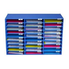 a blue office organizer with lots of folders on it's sides and labels attached to the drawers