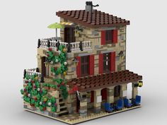 a lego house is shown with red shutters and green trees on the front porch