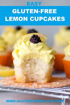 lemon cupcakes with white frosting and blueberries on top