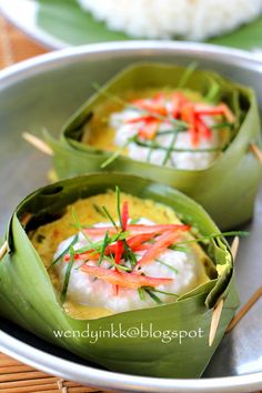 some kind of food on a plate with chopsticks