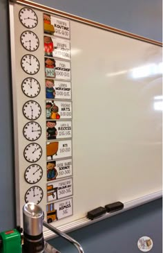 a white board with several different clocks on it and magnets attached to the wall