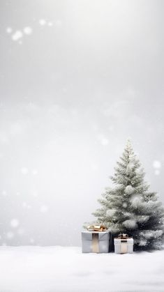 a christmas tree with presents in front of it on snow covered ground and sky background