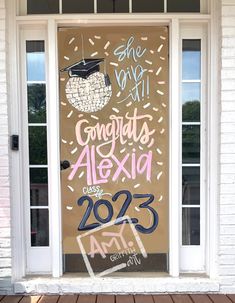 a door with some writing on it in front of a brick building that says congrats alxid