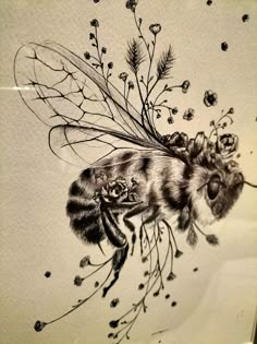 a black and white drawing of a bee