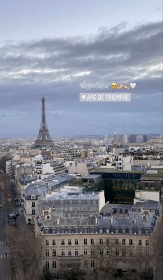 the eiffel tower towering over the city of paris, france is seen from above