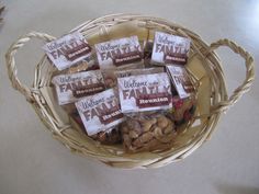 a wicker basket filled with cookies and chocolates on top of a countertop