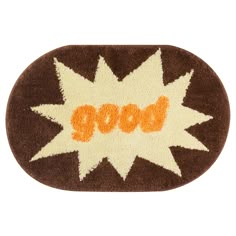 a brown and white rug with the word boo written in orange on it's center