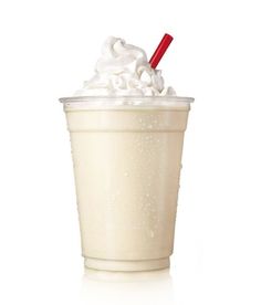 a cup with whipped cream and a red straw