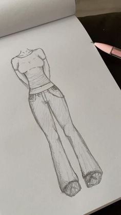 a drawing of a woman's top and pants in pencil on a piece of paper