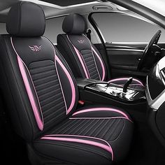 the interior of a car with pink and black trimmings on the front seats