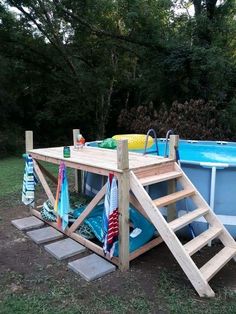 an above ground swimming pool with ladder to the side