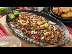 the food is prepared and ready to be eaten on the table with other dishes around it