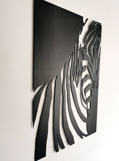 a black and white photo of a zebra's head on a metal wall art piece