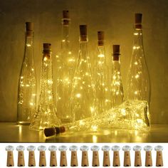 there are many bottles with lights in them