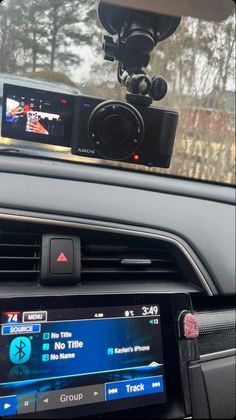 the dash camera is mounted to the dashboard of a car, and it's ready to be driven