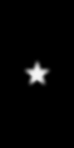 a black and white image of a star in the night sky with only one light visible