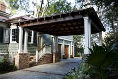 a house with a covered porch and stone walkway