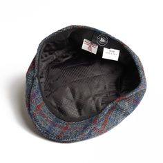 Introducing the Dasmarca Justin Scottish Harris Tweed Winter Cap, a pinnacle of warmth and style for the colder seasons. Crafted with renowned Harris Tweed from Scotland and meticulously constructed in Italy, this cap epitomizes quality and sophistication. Made from 100% virgin wool, it offers supreme insulation against chilly temperatures. Inside, a quilted lining ensures extra warmth and comfort, making it ideal for frosty days. Authenticated with the Dasmarca metal pin, this cap guarantees authenticity and superior craftsmanship. Elevate your winter ensemble with the timeless elegance and unmatched warmth of the Dasmarca Justin Scottish Harris Tweed Winter Cap This cap is designed to develop character and age gracefully over time. It is not recommended for hand or machine washing. If th Age Gracefully, Hat Base, August Birthstone Jewelry, July Birthstone Jewelry, Winter Cap, Flat Cap, Marine Blue, Gifts For New Mums, Jewelry Ring Box